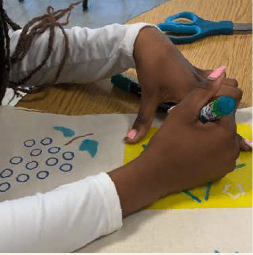 Child drawing with marker